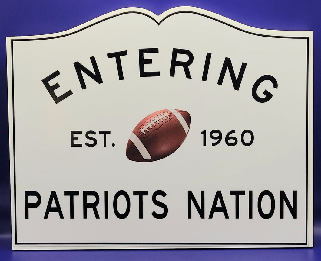 Entering Patriots Nation with Football Sign